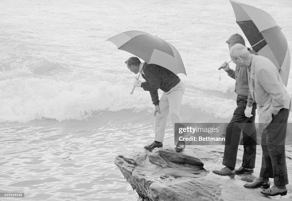 Arnold Palmer Looking for Golf Ball in Surf