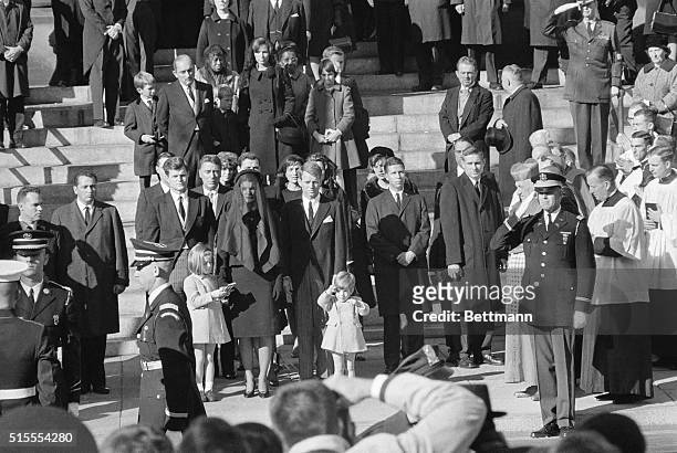 Like a little soldier, John F. Kennedy Jr. Who celebrates his 3rd birthday, salutes at the casket of his father, the late President John F. Kennedy...