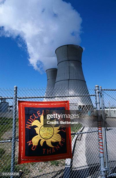 Sign on fence at nuclear power plant, News Photo