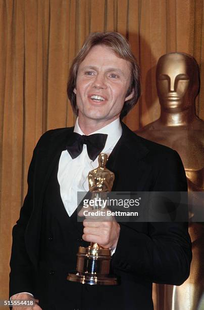 Hollywood: Actor John Voight, winner of the Best Actor In A Leading Role at the 51st Annual Academy Awards, smiles with his Oscar he got for his role...