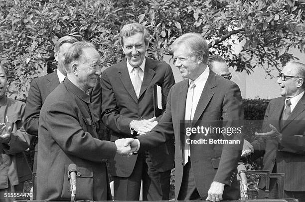 Washington, DC- President Carter and the Chinese Vice Premier shake hands 9/17 after signing a mutual trade agreement between the two countries in a...