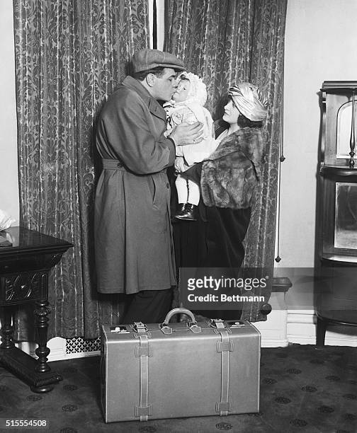 Massachusetts: Ruth Prepares For Departure To Southland. Photo shows German Herman Ruth, more popularly known as the "Babe," kissing Mrs. Ruth and...