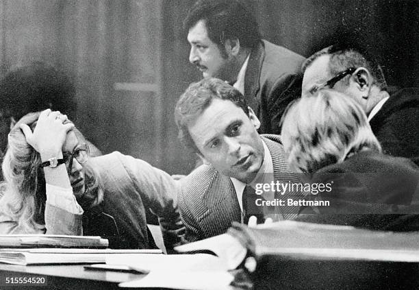 Accused murderer Theodore Bundy confers with his defense attorneys on the opening day of his trial 6/25. The trial will be televised nationwide as...