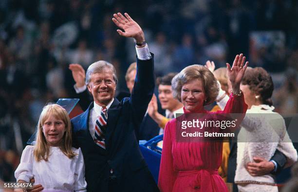 President Jimmy Carter, First Lady Rosalynn Carter, and their daughter, Amy, wave to supporters from the stage at the 1980 Democratic National...