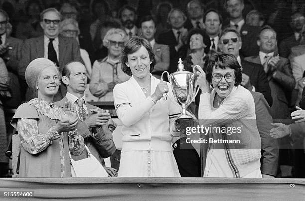Billie Jean King, , and Martina Navrtilova, , hold trophy after winning the women's Double final here. It was King's record 20th Wimbledon title....