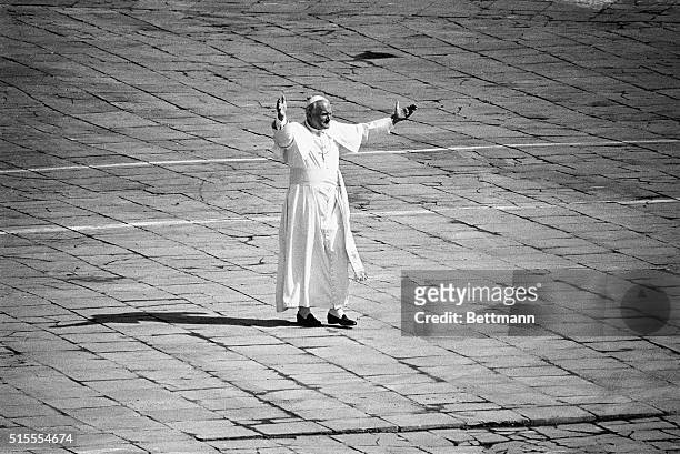 Warsaw, Poland- Pope John Paul II stands alone in Warsaw's Victory Square after it had been cleared for the landing of a helicopter that will fly the...