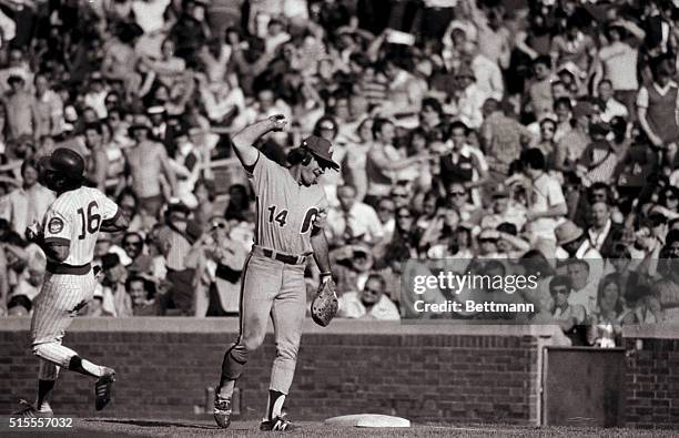 Chicago, IL- ORIGINAL CAPTION READS: Phillies' Pete Rose lifts his arm in victory after the last out in the tenth inning giving Philadelphia a 23-22...