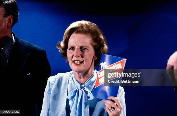 London, England: Mrs. Margaret Thatcher holding up her party's manifesto, when she held the Conservative Party's first press conference of their...