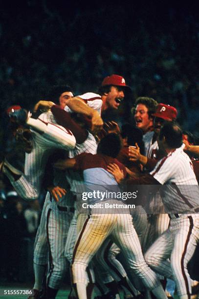 Philadelphia: World Series Most Valuable Player, Mike Schmidt, of the Phillies, is hoisted into the air as the Phils celebrated victory, October 21,...