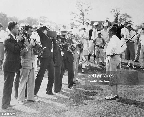 New York: Bobby Jones, Atlanta wizard, is seen posing for photographers after scoring a sensational 69, over the difficult Winged Foot Golf Club...