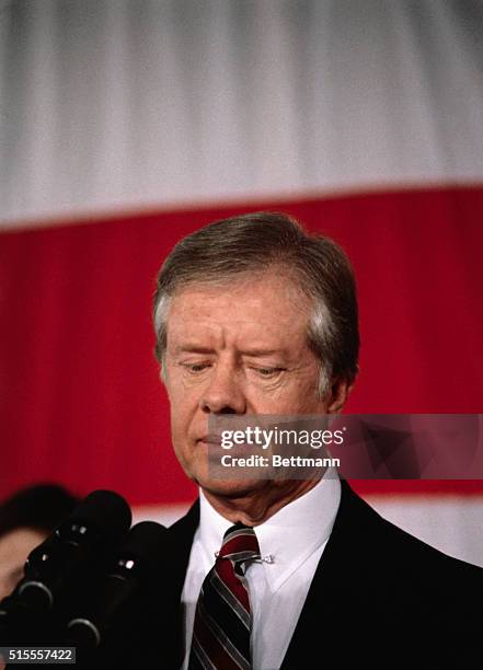 President Jimmy Carter, conceding to Ronald Reagan. Closeup of Carter with depressed expression on his face.