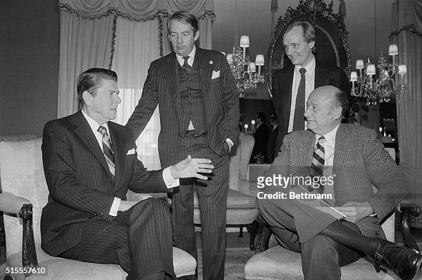 New York: President Reagan , meets with New York City Mayor Ed Koch , 3/14, at the Waldorf. Standing are Fire Comm. Charles Hynes , and City Budget...