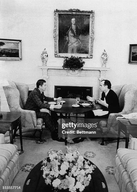 Washington: President Ronald Reagan and Vice President George Bush discuss the formation of the President's task Force on regulatory reform which...