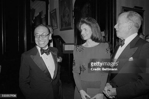 Architect I. M. Pei chats here with Jacqueline Kennedy Onassis, who was on hand to congratulate him at National Arts Club's 82nd Annual Award Dinner....