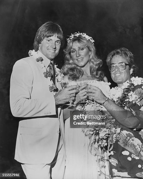 Honolulu: Bruce Jenner and his bride, Linda Thompson, toast each other following their wedding on the beach in Oahu, Hawaii, at the home of producer...