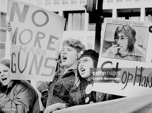 In the wake of John Lennon's death, a group of protesters gather outside the National Rifle Association in an anti-handgun demonstration 12/12...