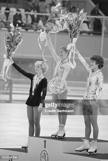 Sapparo, Japan: Women's singles winners wave flower bouquets during awarding ceremony in the International Figure Skating Competitions at Makomanai...