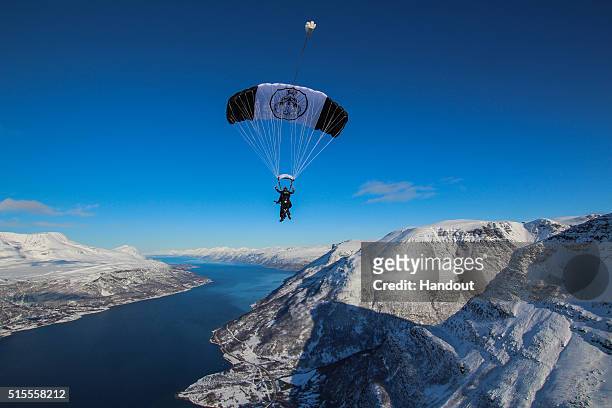 Matt Tuck, descending with his tandem instructor Nathan Connelly, starts the gig above Lyngsfjord,192 miles north of the Arctic Circle during...
