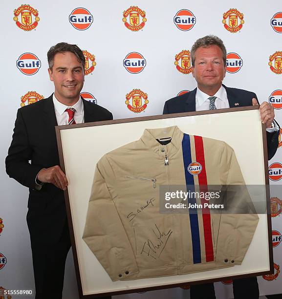 Gulf Oil International vice president Frank Rutten presents Jamie Reigle, Manchester United Commercial Director, with a signed Gulf Oil jacket at the...