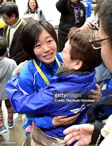 Athens Olympic Women's marathon gold medalist Mizuki Noguchi hugs with her mother after competing in the Nagoya Women's Marathon at the Nagoya Dome...