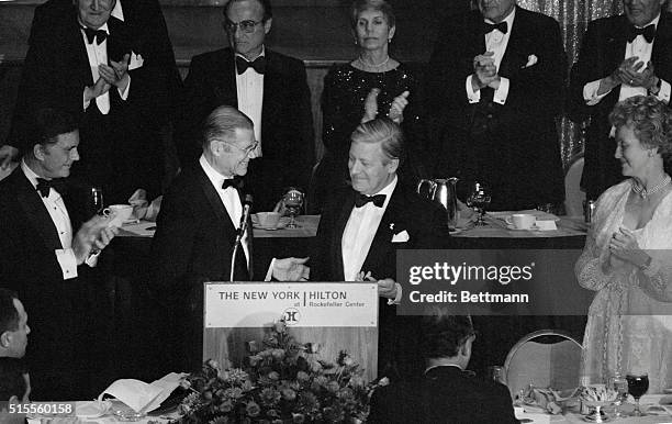 New York: West German Chancellor Helmut Schmidt, right, is presented with the 1980 Family of Man Medallion by World Bank President Robert McNamara at...