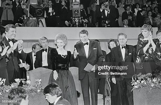Londover, MD.: President-elect and Mrs. Ronald Reagan wave to the crowd as they arrive at the Capital Centre for the 1981 Presidential Inaugural...