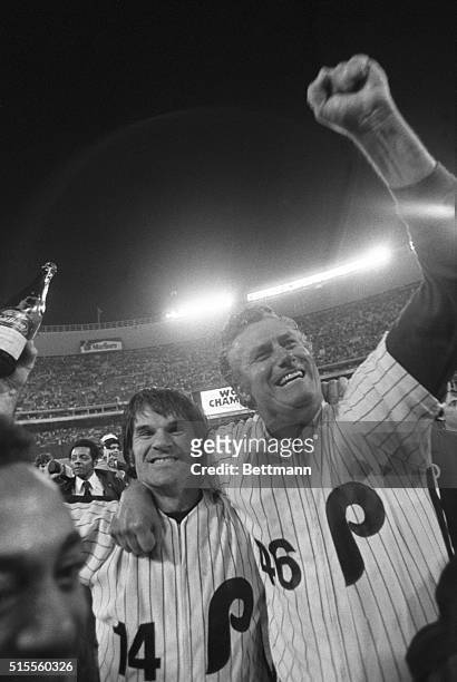 Pete Rose is hugged by Phillies' manager Dallas Green 10/21 after the Phils defeated Kansas City 4-1 to win the World Series in six games.