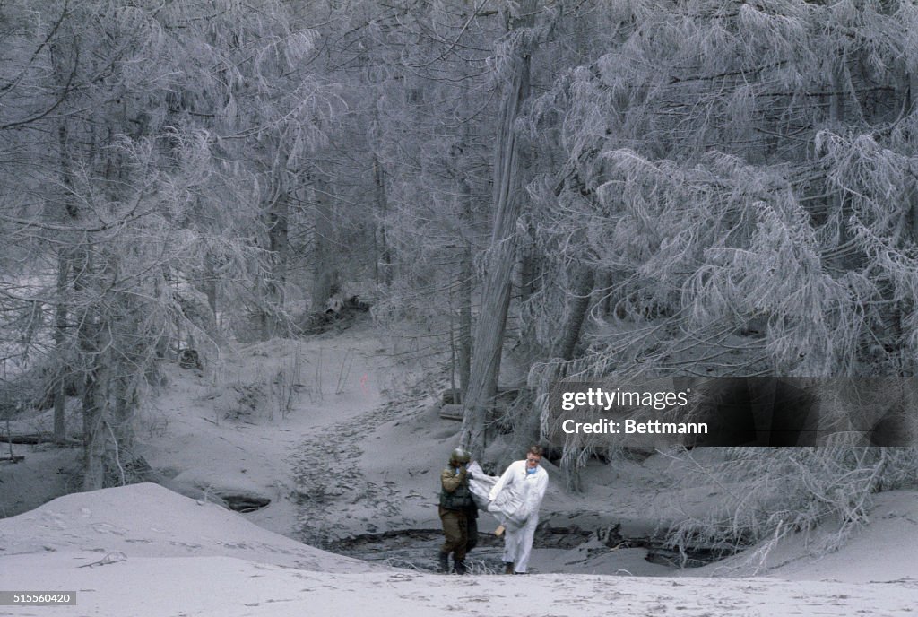 Rescuers Removing Victim of Volcano Eruption