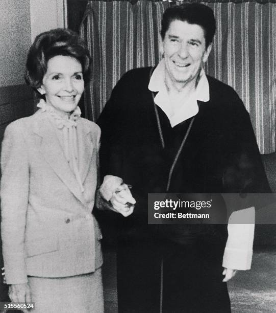 Washington: First Lady Nancy Reagan visits with her husband President Reagan in his room at the George Washington University Medical Center, where...