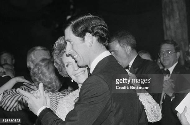 Manhattan, New York, New York: Prince Charles and Mrs. Ronald Reagan drink a toast at a party in Damrosch Park in Lincoln Center after a performance...