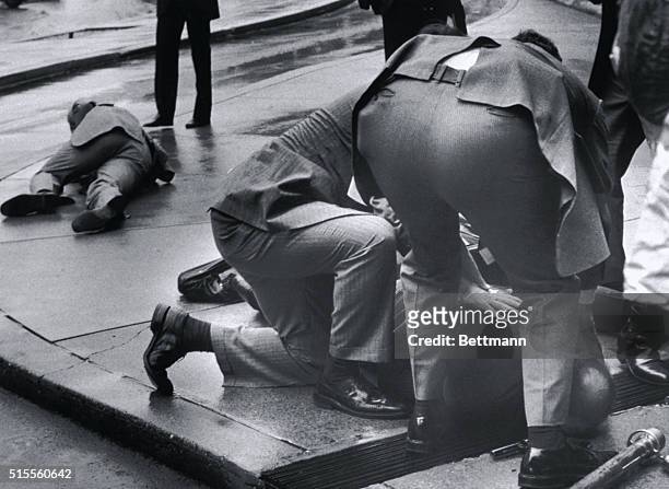 Washington, D.C.- Press Secretary James Brady lies on the ground outside the Washington Hilton after being shot by John Hinckley Jr.