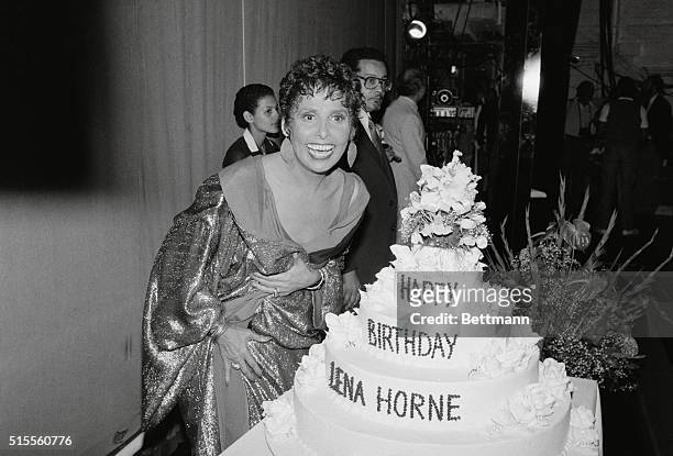 New York: Lena Horne stands next to huge cake 6/30 during celebration marking her 64th birthday on stage of the Nederlander Theater following the...