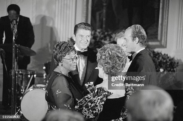 Washington, D.C.: President Reagan and First Lady Nancy introduce Ella Fitzgerald to King Juan Carlos and Queen Sophia of Spain during a state dinner...