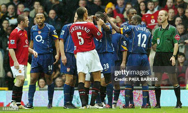 Manchester United's Rio Ferdinand argues with Arsenal's Kolo Toure during their Premier League football match at Old Trafford, Manchester, United...