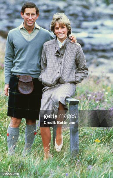 Balmoral, Scotland-ORIGINAL CAPTION READS: Prince Charles and Princess Diana pose together at Balmoral. The happy couple are shown full length and...