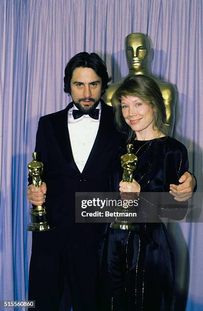 Actor Robert De Niro and actress Sissy Spacek show their Oscars which they won for Best Actor and Best Actress of the year. De Niro his role in...