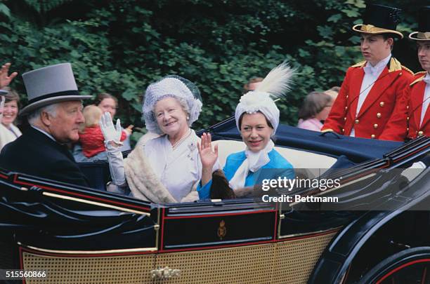 It's tradition! The Royal Family, riding in open landaus, moves down Watersplash Lane, then turns into the Royal Ascot Course, to start Ascot racing...