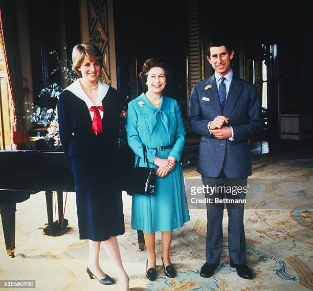 Lady Diana Spencer and Prince Charles pose with Queen Elizabeth at Buckingham Palace, London, in March 1981, the day that their wedding was...
