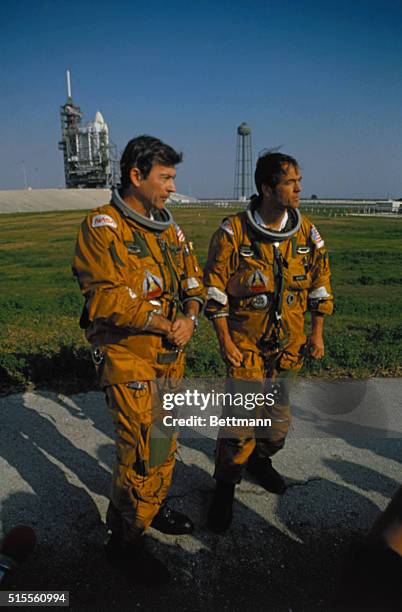 Cape Canaveral, Fla.: Space shuttle astronaut John Young, L, is pensive as Columbia pilot Robert Crippen tells members of the news media that "it...