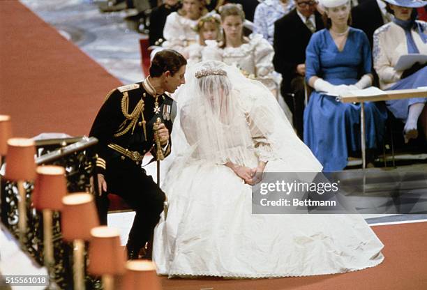 Prince Charles and Lady Diana Spencer, sitting and whispering to each other during their wedding ceremony at at St Paul's Cathedral, London, 27th...