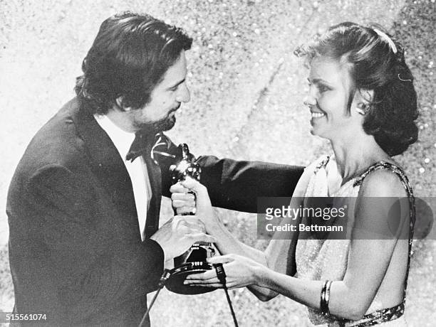March 31, 1981 - Hollywood: Actress Sally Fields presents an Oscar to actor Robert De Niro for his role in "Raging Bull," De Niro's Oscar was for...