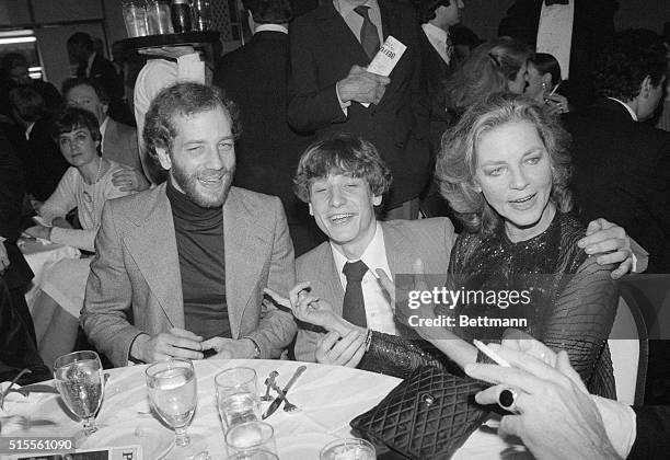 New York, New York: At the party following the Broadway opening of Woman of the Year, the star Lauren Bacall, celebrated with her two sons, Steve...