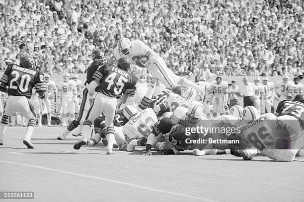 Tampa Bay Buccaneers' Ricky Bell goes up and over for a first down on the Chicago 27-yard-line in the first quarter of the game against the Chicago...