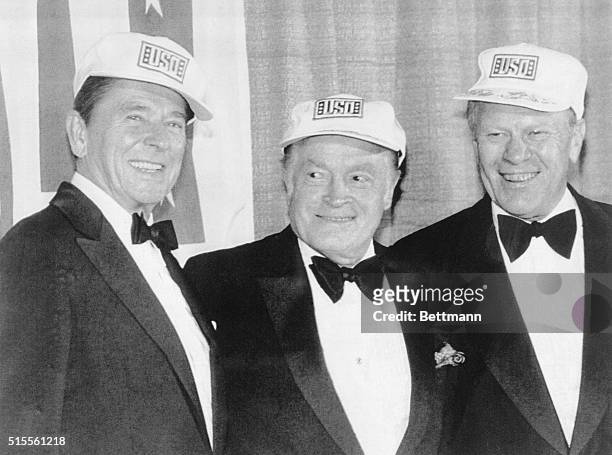 Washington, D.C.: President Reagan wearing a USO hat joins Bob Hope and former president Gerald Ford on stage during a gala for the 40th anniversary...
