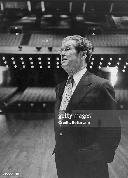 Roy Acuff stands on the stage of the Grand Ole Opry House where he still performs. He says some of today's country music is getting away from basics...