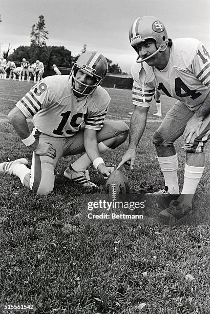 San Francisco 49ers' quarterback Joe Montana is shown with Dwight Clark and Ray Wersching, kicker . Montana's regular number is 16. However, this day...