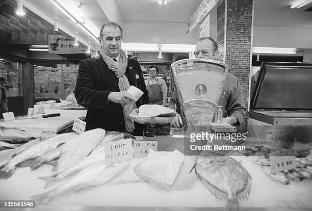 On his early morning sweep through the Les Halles Market in nearby Lyon, chef Paul Bocuse gathers up a huge salmon , sole and monkfish.