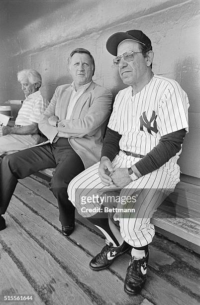 New York Yankees owner George Steinbrenner and Manager Yogi Berra laugh it up in the dugout after a comment was made about the fat stomach of a...