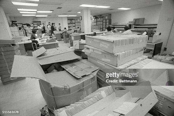 Boxes of alien registration forms await processing at Washington offices of the Immigration and Naturalization Service recently. Robert Kane of the...
