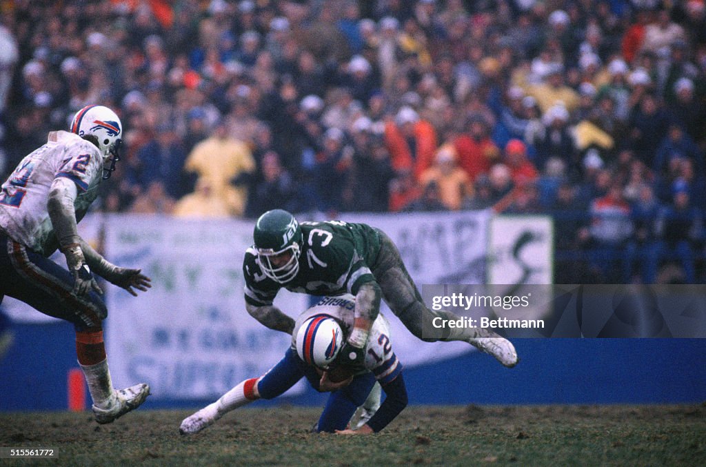 Football Action with Jets and Buffalo Bills Players